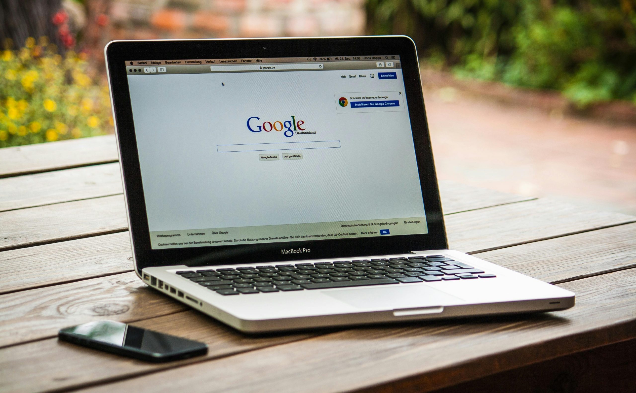 laptop displaying Google homepage on the screen